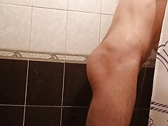 Guy washes himself in the shower and cums