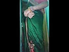 Indian gay Crossdresser Gaurisissy in Green Saree pressing her big Boobs and fingering in her ass