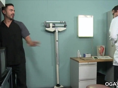 Physician tugging his dinky when the intern comes in