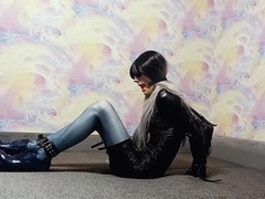 A crossdresser roped in an armbinder and ball-gagged, incapable to unwind the bonds