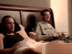 Two amateur freaks jerk off together in a cheap motel room