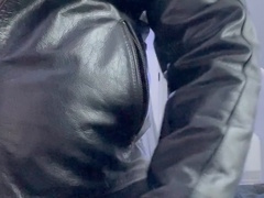 Bearded hunk in a leather jacket pleasures himself with his leather glove