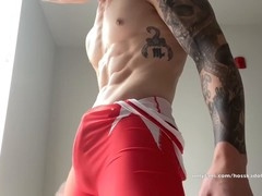 Muscle hunk Hoss Kado masturbates in wrestling singlet and cums hard