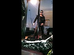 posing in black shiny nike trackies, black jacket