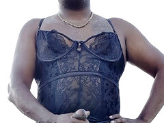 Crossdresser in a basque with stockings