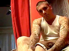 Thug jock Evan Heinze massaging socks in foot fetish solo