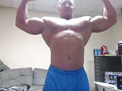 Bald bodybuilder flex, work out, and jerk off