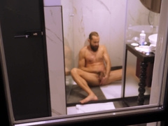 Mature boy filmed from outside while taking a bathroom and wanking off his rock hard wood