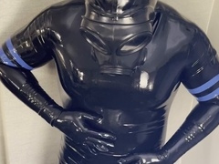 Latex-clad drone shoots his load inside his rubber sock