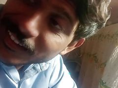 Handsome man showing his  face to his fan's.