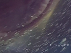 The dude ejaculates in a love glove with warm water with strong volleys