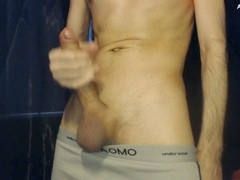 Slim hunk strokes massive dick for your pleasure