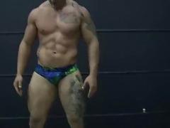 Near-naked men show off their incredible bodies while wrestling