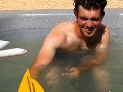 Dashing jock relaxes in an outdoor pool before jerking off