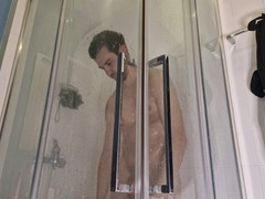 Hot muscular stud enjoys steamy time in the shower