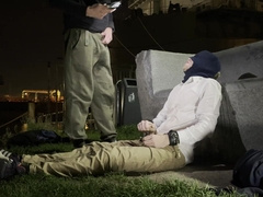 2 masculine folks, they don't know each other, urinating in a public place to greet each other.