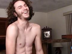 Skinny thug with long hair vigorously tugs on his hard dick