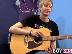 Young man plays guitar before dick stroking and cumming