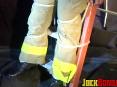 Man in uniform muffled as he is restrained and afraid