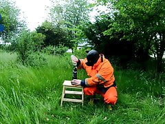 Riding dino toy in garden wearing hivis and rubber boots