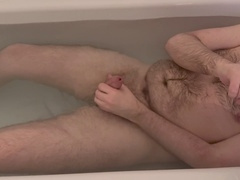 Hairy Scottish lad indulges in a relaxing bath, releases his load