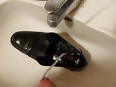 Piss in men's dress shoe