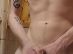 Fit teenage draining off in shower (cum-shot)