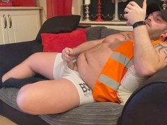 Sweaty builder jerks off and cums on couch in urine-soaked undies