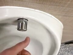 Cruising in public toilets wanking my hard cock