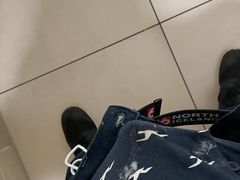 boy is wanking in mall stall bathroom