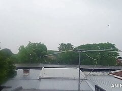 Mature man masturbating in front of window with the rain.