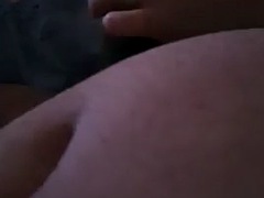 Slutty stepmom handjobs stepson cock in bed while she watches porn and TV