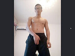 Hairy Asian muscle hunk jerks off in front of the camera