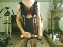 Crossdresser wearing his wife's sexy black mini dress and jerking off his cock on webcam.
