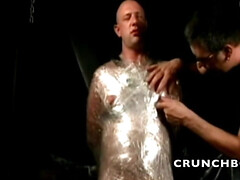 BDSM session with bondage and spanking in backroom