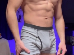 MUSCLED FELLOW JACKS HIS LOLLIPOP WHILE FLEXING