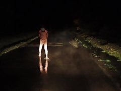 Flowding - exhib naked in water on a road