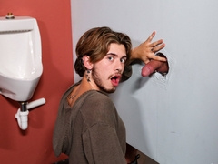 Muscular man with a tattooed body and a skinny fellow