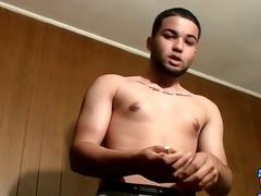 Handsome jock pulls his dick out to masturbate while smoking