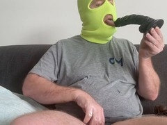 Choking on a massive black dildo