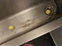 Cumming at the urinal