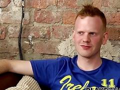 Naughty twink strips clothes during an interview and jerks off
