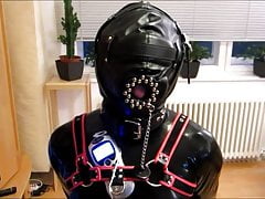 Rubber Gimp in the pillory