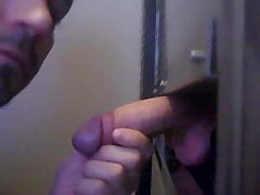 Huge cock unloads at the gloryhole