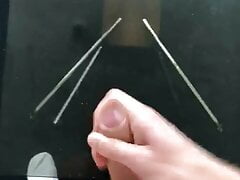 Uncut white cock cum on glass table