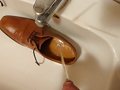 Piss in men's dress shoe