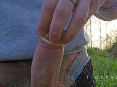 Dominate man makes his made-up buddy throat and fill condom with cum