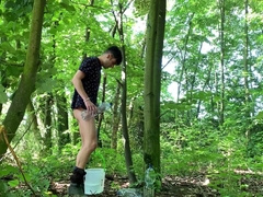 Testicles spreading outdoor with bucket packed with water and masturbate off