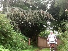 In a black and white maid outfit to carry the garbage