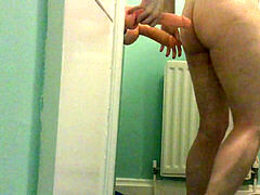 Sissy taking many sized dildos in bathroom homemade
